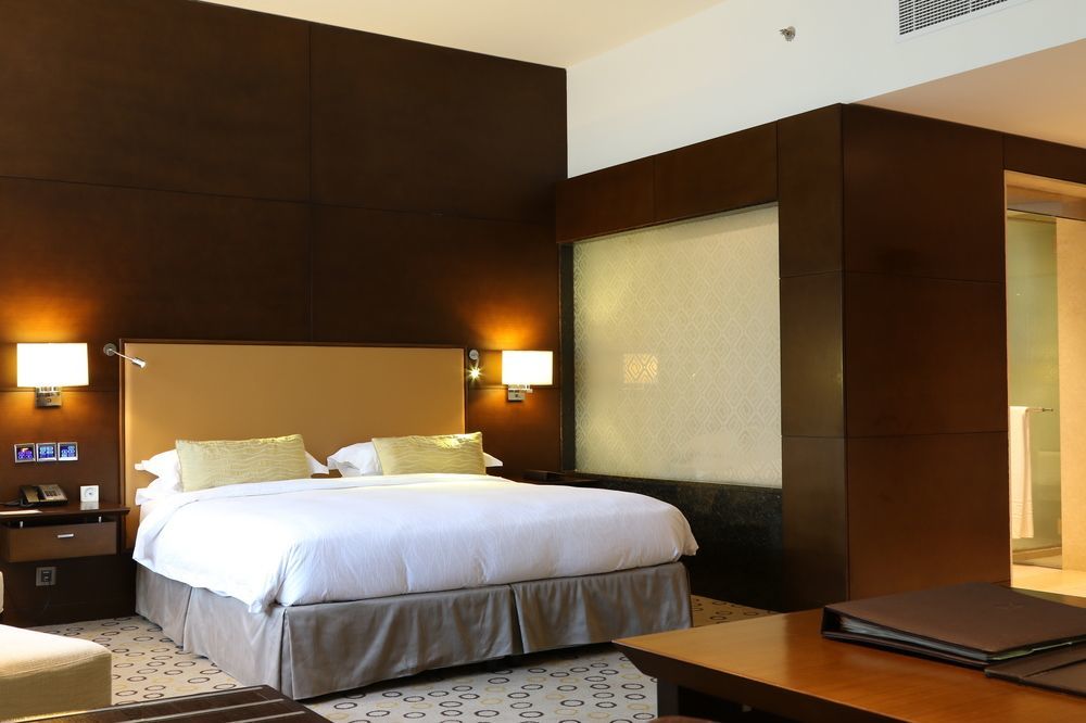 Asiana Hotel Dubai Exterior foto A bedroom at the hotel